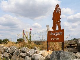 A sign with a hawk sculpture at Moorgate Farm in Okehampton