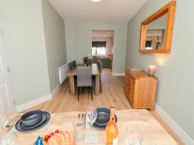 A dining room with a table set for a meal at Portobell House in Bridlington