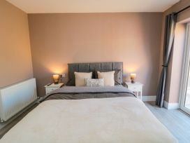 A bedroom with bed and bedside tables at Portobell House in Bridlington