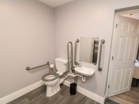A bathroom with a toilet and sink at Portobell House in Bridlington
