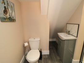 A bathroom with a toilet and sink at Portobell House in Bridlington