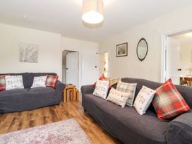 A living room with sofas and a coffee table at Irt Cottage in Seascale