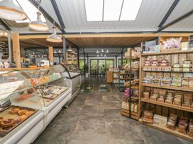 A store with display cases and shelves at Irt Cottage in Seascale