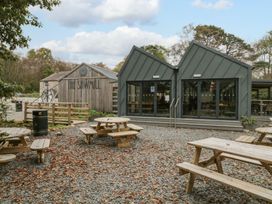 An outdoor area with tables near The Sawmill in Seascale