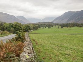 A landscape view with a road and mountains at Irt Cottage Seascale