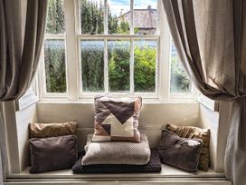 A window seat with cushions at Prudhoe Cottage in Prudhoe
