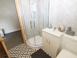A bathroom with a shower and sink at Prudhoe Cottage in Prudhoe