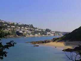 A view of houses on a hill by the river at Beachstone in Salcombe