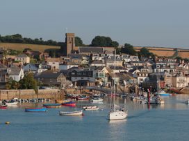 A view of a harbor with boats and buildings at Beachstone in Salcombe