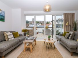 A living room with sofas and a coffee table at Beachstone in Salcombe