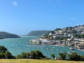 A view of a bay with boats and houses at Beachstone in Salcombe