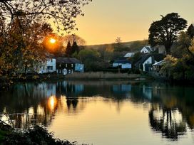 A scenic view of houses by a river at Beachstone in Salcombe