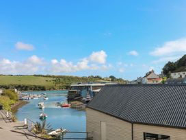A view of boats on water and buildings by the shore at Beachstone in Salcombe