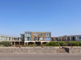 A building with balconies and plants at 16 Old Shipyard Centre, West Bay