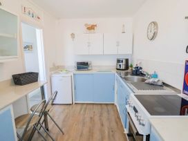 A kitchen with appliances and countertop at 16 Old Shipyard Centre, West Bay