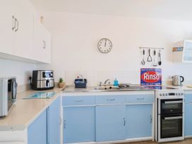 A kitchen with appliances and utensils at 16 Old Shipyard Centre West Bay