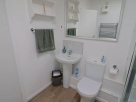 A bathroom with a sink and toilet at 16 Old Shipyard Centre, West Bay