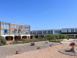 A building complex with gardens at 16 Old Shipyard Centre West Bay