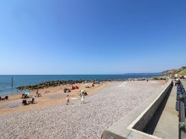 A beach with people relaxing and water at 16 Old Shipyard Centre West Bay