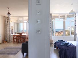 A living room with a dining area visible at 16 Old Shipyard Centre West Bay