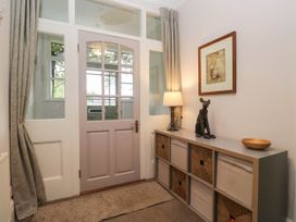 An entrance hall with a front door and storage unit at Briargarth in Keswick