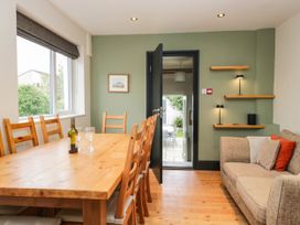 A dining room with a table and chairs at Briargarth in Keswick