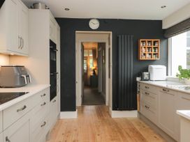 A kitchen with appliances and cabinets at Briargarth in Keswick