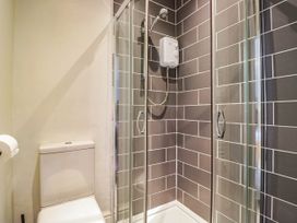 A bathroom with a shower and toilet at Briargarth in Keswick