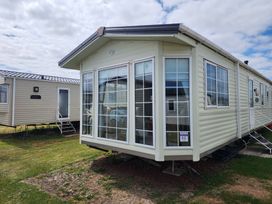 A mobile home with large windows at Whitley bay parkdean resorts - 52 Beechfield Whitley Bay