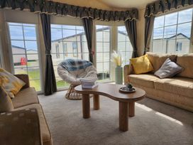 A snug with seating area and large windows at Whitley bay parkdean resorts - 52 Beechfield, Whitley Bay