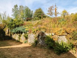 A garden with steps and plants at Dashel Cottage at Dockwell Farm near Widecombe-In-The-Moor