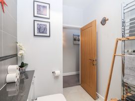 A bathroom with a toilet and sink at The Old Dairy near Liskeard