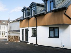 A house with multiple windows and doors at Greenswood Mews in Brixham