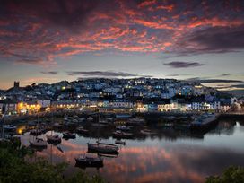 A view of the harbour with boats and buildings at Greenswood Mews in Brixham