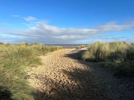 A path through sand dunes at Sea Breeze A Beautiful 3 Bed Pet Friendly Retreat Mablethorpe