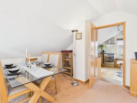 A dining room with a table set for four at Apartment Sleeps 4 Enclosed Garden Pets Welcome in Flushing