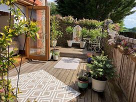 An outdoor area with plants and seating at The Old Chapel of Ermington in Ermington