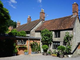 A house with chimneys and planters in an outdoor area at the property