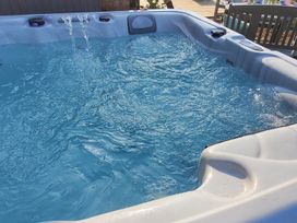 A hot tub filled with water at 3 Bedroom Cottage Hot Tub Garden Parking Dunkeswell