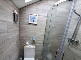 A bathroom with a shower and toilet at 3 Bedroom Cottage Hot Tub Garden Parking Dunkeswell