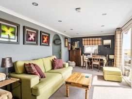 A living room with a sofa and coffee table at '' in ''