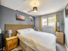 A bedroom with a bed and bedside table at the property in the location
