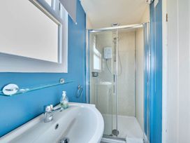A bathroom with a sink and shower at The Old Barn in Manchester