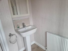 A bathroom with a sink and mirror at Pet Friendly 2Bed Luxury Lodge in Routh HotTub