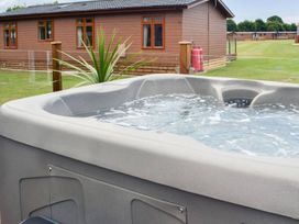 A hot tub in an outdoor area at Boutique lodge with hot tub sleeps 6 in Bridlington