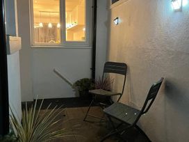 An outdoor seating area with chairs and plants at Charming 3Bed Cottage Private Garden Parking Torquay