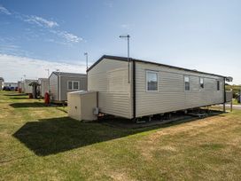 Static caravans lined up in an outdoor area at Cayton Bay Holiday Park Kestrel40, Cayton Bay