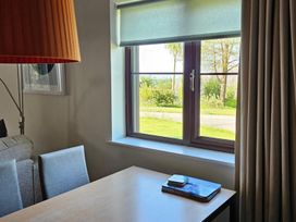 A living room with window and desk at 2bed sleeps4 pool freeparking Trenythonestate Near Par