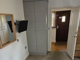 A bedroom with a wardrobe and mirror at 2bed sleeps4 pool freeparking Trenythonestate Near Par