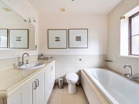 A bathroom with a sink, toilet, and bathtub at 2bed sleeps4 pool freeparking Trenythonestate Near Par